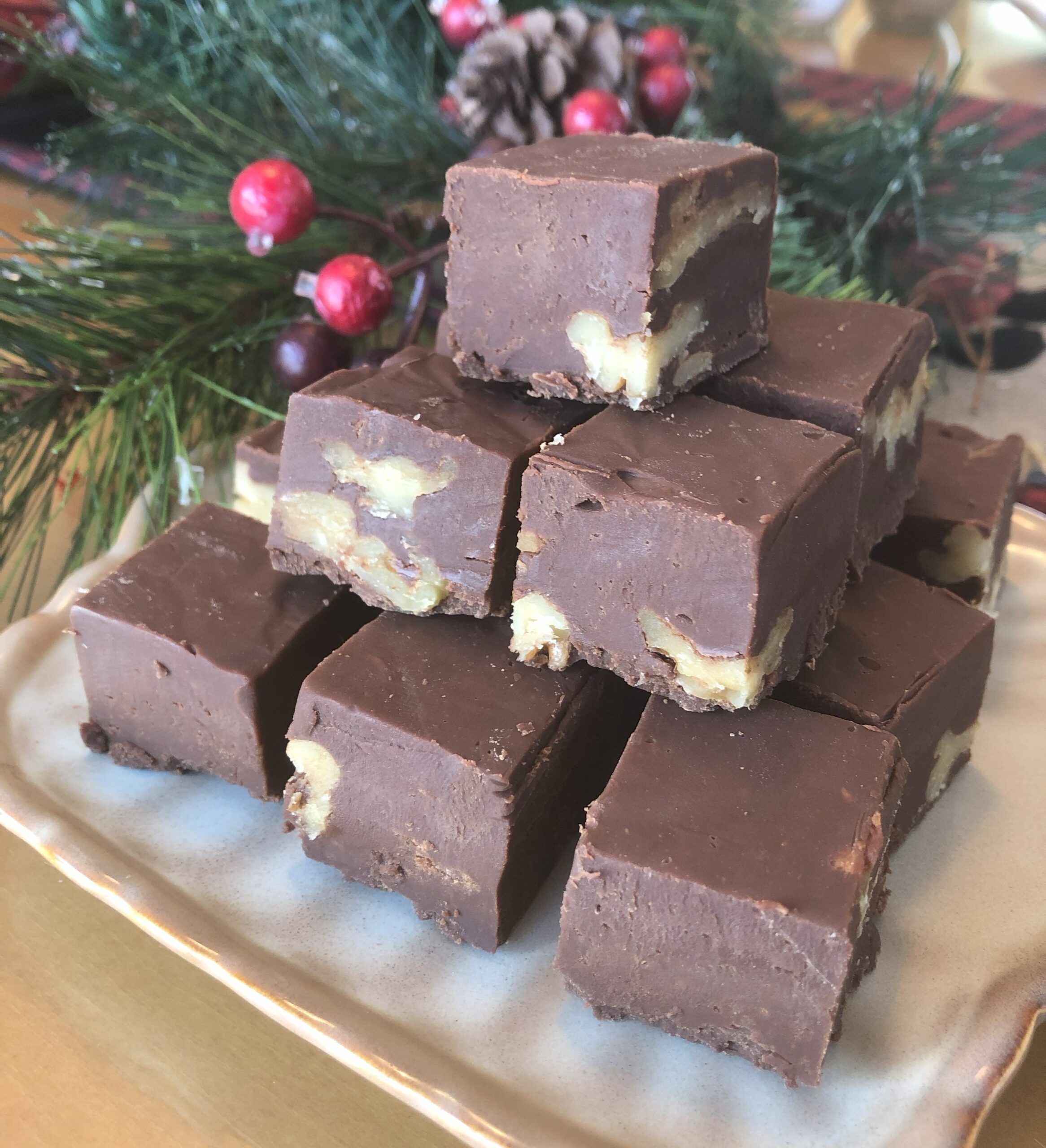 Beautifully displayed Chocolate Fudge on a Christmas decorated table.