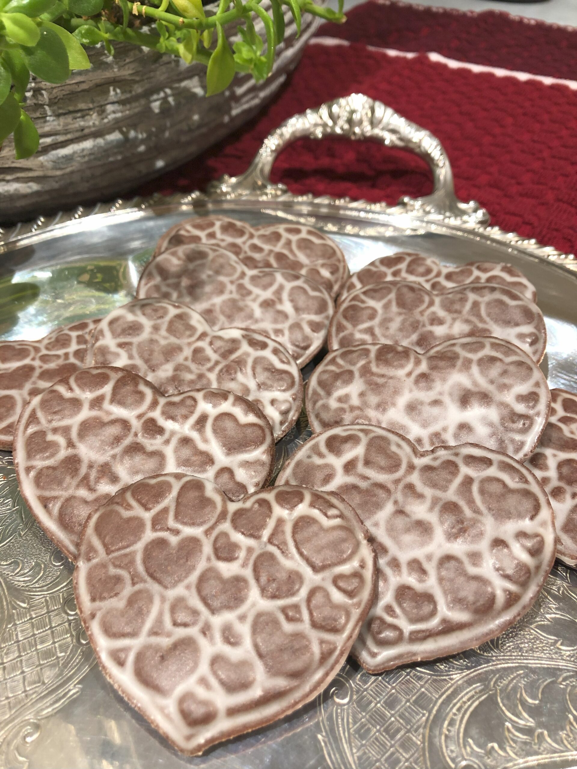 Chocolate Glazed Heart Cookies displayed on silver serving tray.