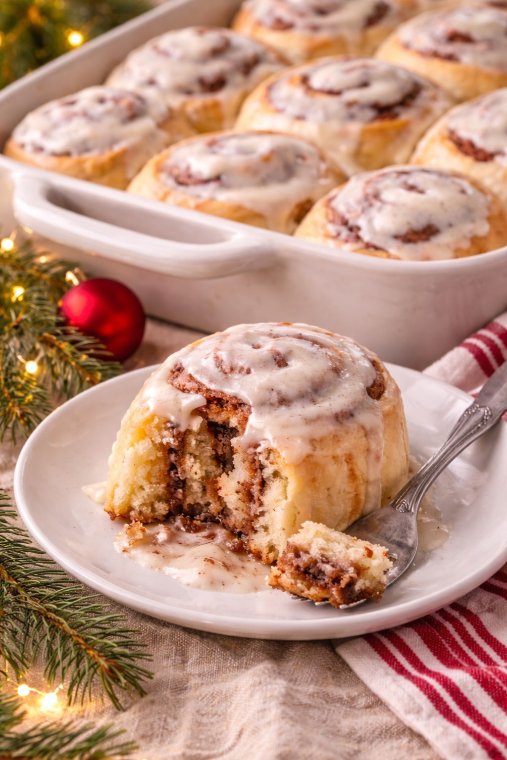 Cinnamon Rolls with Vanilla Bean Icing plated on the table.