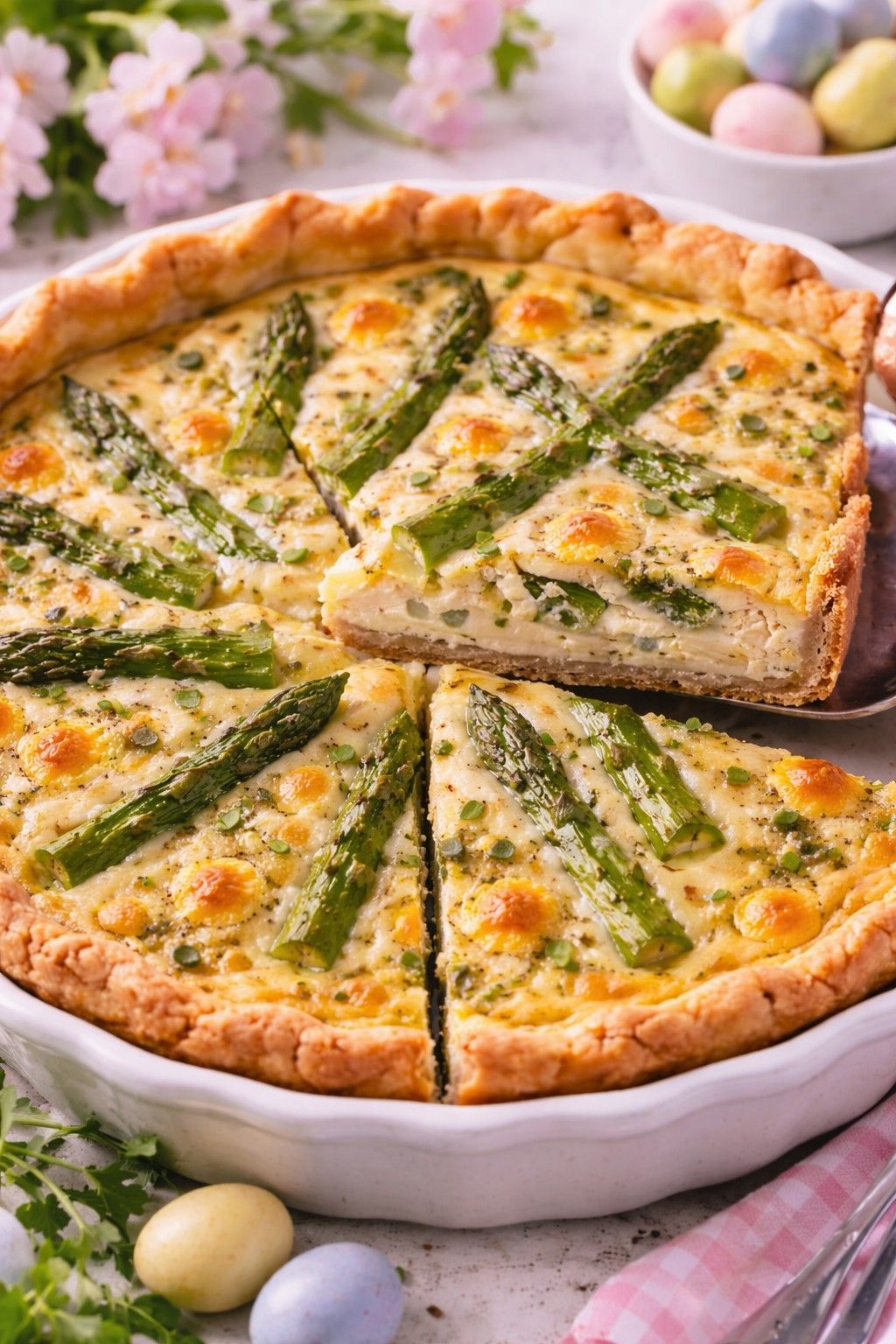 Sliced Asparagus and Gruyere Quiche on the table.